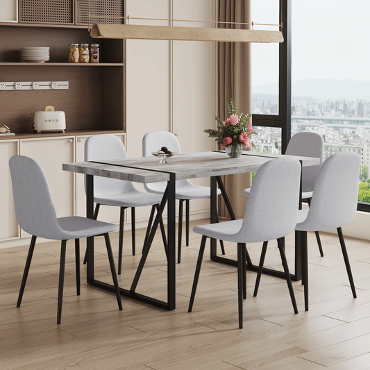 Table and Chair set.A Minimalist Retro Rectangular Dining Table With a Specially Textured Top and Black Metal legs.Paire