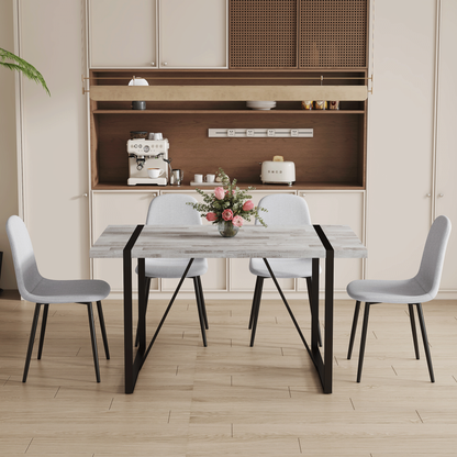 Table and Chair set.A Minimalist Retro Rectangular Dining Table With a Specially Textured Top and Black Metal legs.Paire