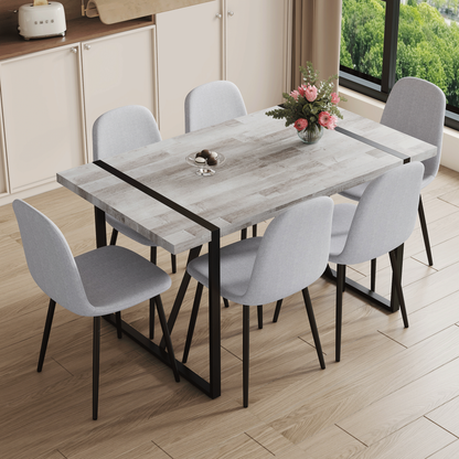 Table and Chair set.A Minimalist Retro Rectangular Dining Table With a Specially Textured Top and Black Metal legs.Paire
