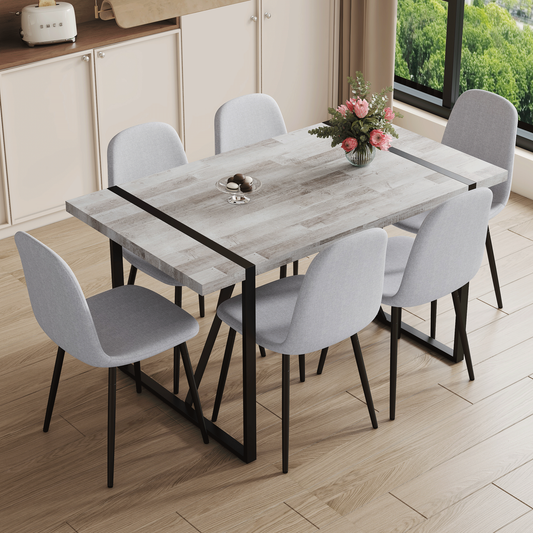 Table and Chair set.A Minimalist Retro Rectangular Dining Table With a Specially Textured Top and Black Metal legs.Paire