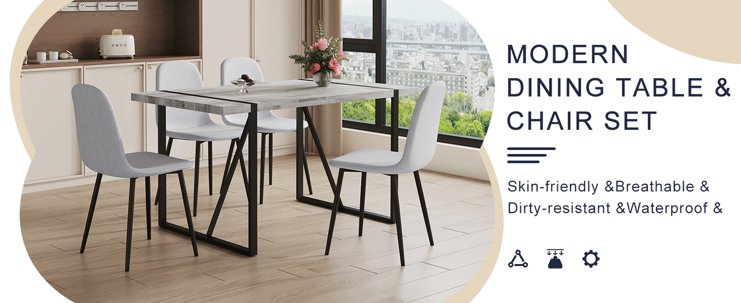 Table and Chair set.A Minimalist Retro Rectangular Dining Table With a Specially Textured Top and Black Metal legs.Paire