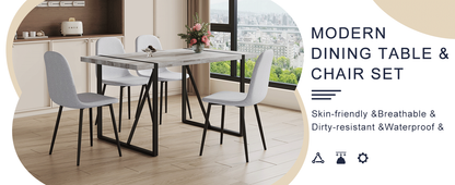 Table and Chair set.A Minimalist Retro Rectangular Dining Table With a Specially Textured Top and Black Metal legs.Paire