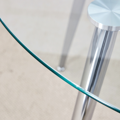 Table and Chair set.A 38.6' Transparent Tempered Glass Round Dining Table-Silver Metal Legs.Paired With 6 BLACK PU Mater