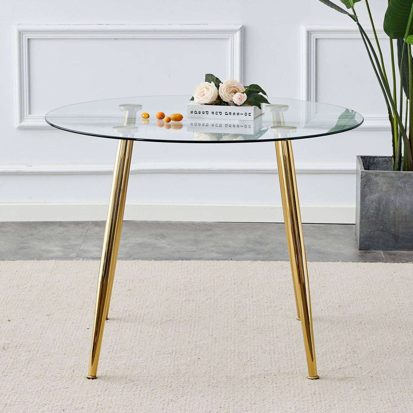 A Glass Tabletop With a Diameter of 40 Inches and a Modern Minimalist Circular Dining Table With Gold Plated Metal Legs.