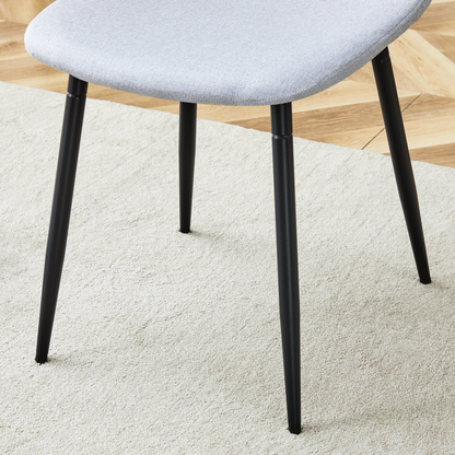 Table and Chair set.A Minimalist Retro Rectangular Dining Table With a Specially Textured Top and Black Metal legs.Paire