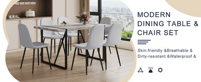 Table and Chair set.A Minimalist Retro Rectangular Dining Table With a Specially Textured Top and Black Metal legs.Paire