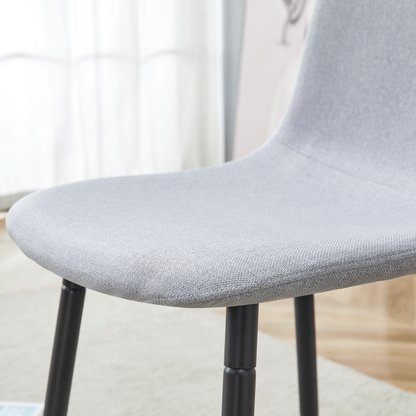 Table and Chair set.A Minimalist Retro Rectangular Dining Table With a Specially Textured Top and Black Metal legs.Paire