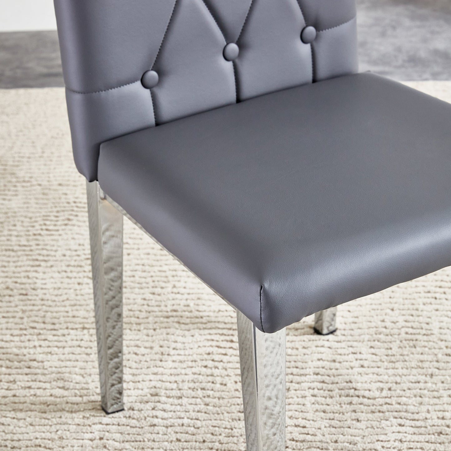 4 Piece Set of Gray Armless Dining Chairs Brings a Touch of Elegance and Mystery to the Dining Area With Its Deep Gray T